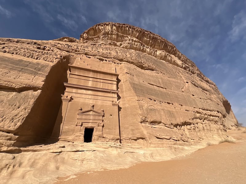 Rock-cut façade at Hegra, the southern Nabataean capital in Saudi Arabia, carved into towering sandstone cliffs along ancient trade routes