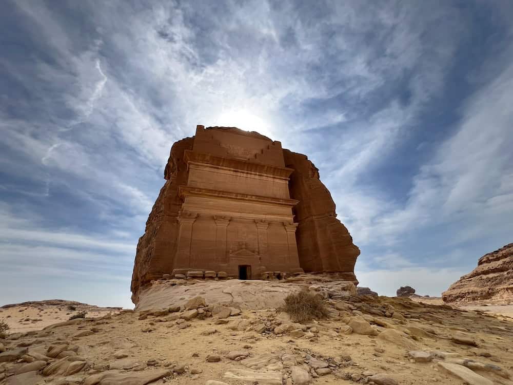 Monumental Nabataean tomb carved into sandstone cliffs at Hegra in Al-Ula, a UNESCO World Heritage Site