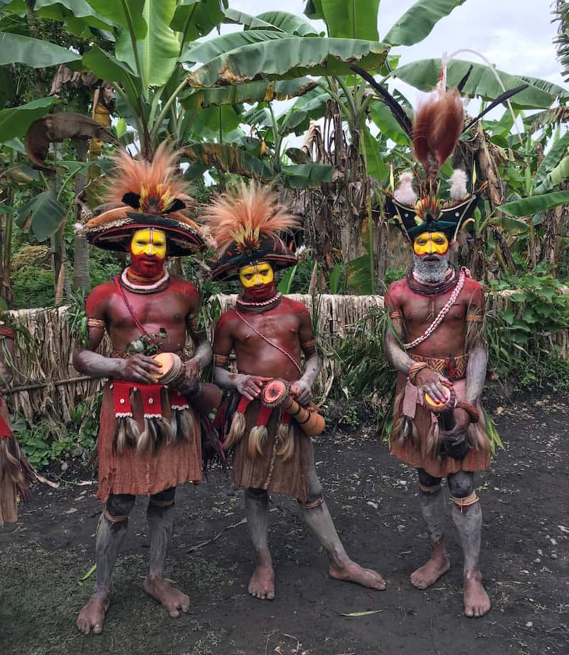 Highland sing-sing performers in traditional dress and face paint in Papua New Guinea