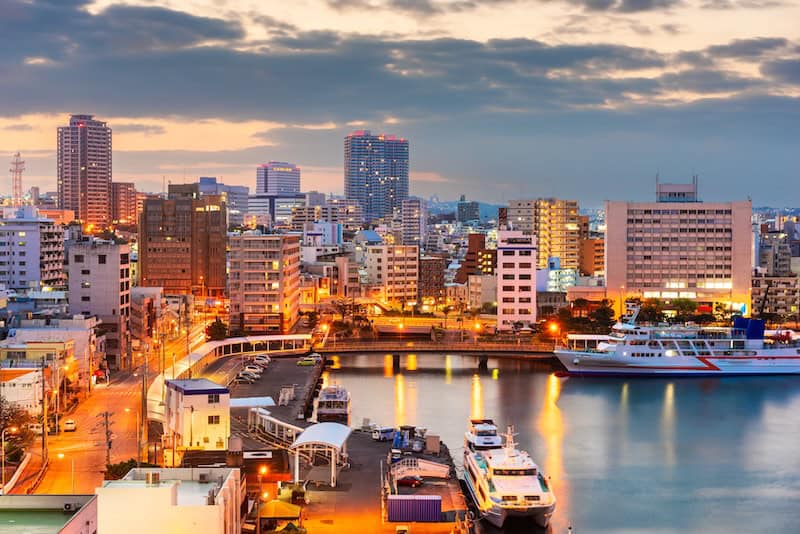 Naha city skyline and harbor at dusk on Okinawa Island, Japan