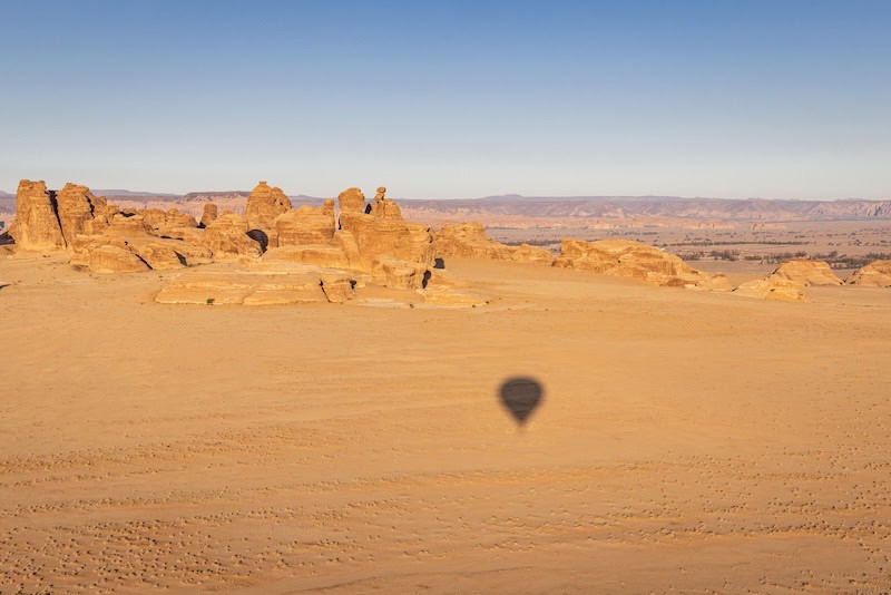Desert rock formations near AlUla viewed from a hot air balloon during a Saudi Arabia tour