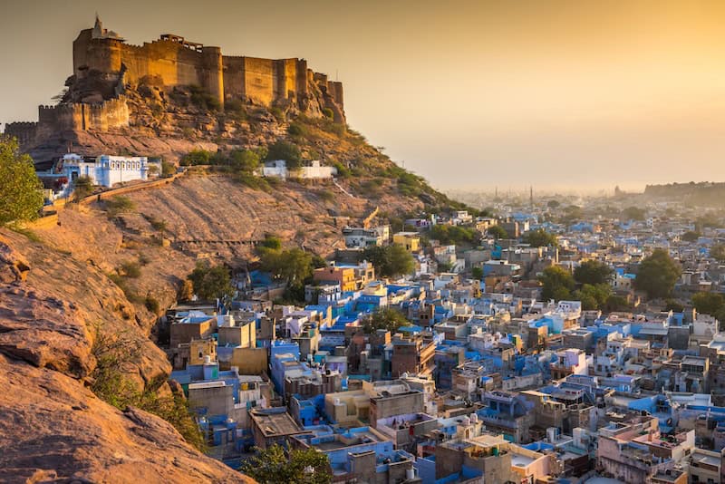 Mehrangarh Fort overlooking the blue-painted rooftops of Jodhpur's old city at sunset